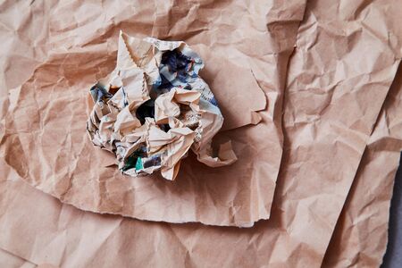 Fake news, disinformation or false information and propaganda concept. Crumpled newspaper on the background Kraft paperの写真素材