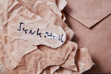 Junk mail or spam e-mail and unsolicited letter idea. Inscription junk mail filled with proofreaderの写真素材