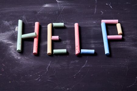 Concept for fear, domestic violence and family or child abuse. The inscription on the help of coloured chalkの写真素材