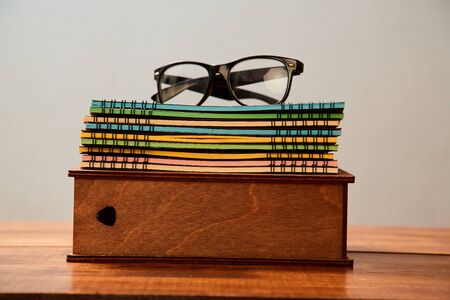 Reading, storytelling and education. Concept for writing, writer and fiction. Glasses on the boxの写真素材