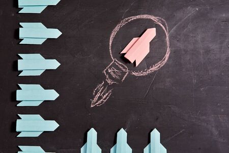 Business original idea, individuality and creativity. Success and motivation concept. Paper rocket...
