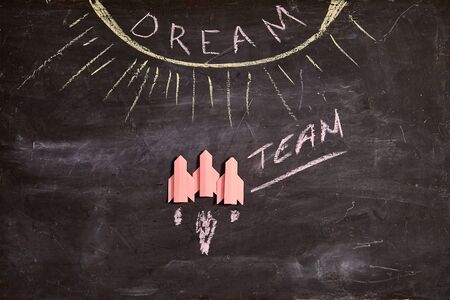 Unity and teamwork concept: Dream team, collaborate and cooperation. Three red rockets and the inscription dream teamの写真素材