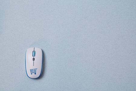 order online and e-business. Computer mouse with the inscription. Blue backgroundの写真素材