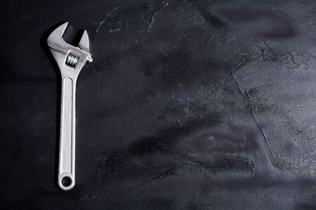 Home servises. Customer service and client support. Wrench on the blackboard. Copy space,...