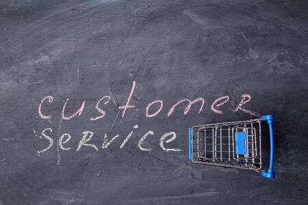 Home servises. Customer service, client support. Copy space. Inscription customer service and shopping basket.の写真素材