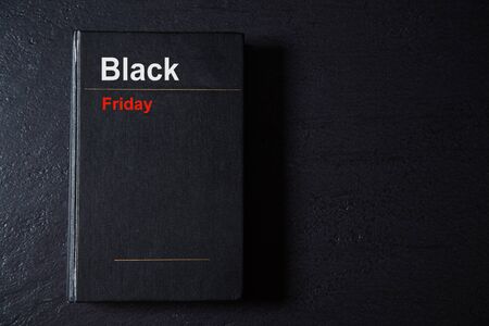 Black Friday, Shopping and commerce concept. Background, copy space. Book on black background