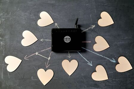 Internet or online dating. Global communication, networking and social media. router and hearts