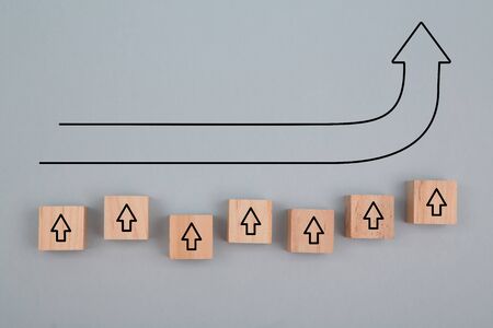 Growth and development mockup. Business promotion. Increase income. Business growth. Wooden cube, rise up arrow signの写真素材