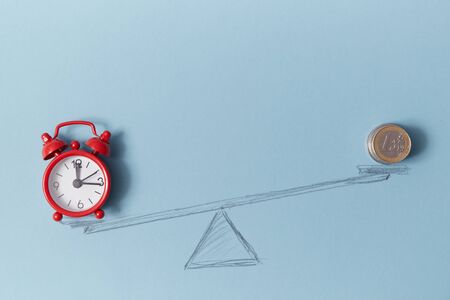 Time is money. Time is valuable resource. Time-limit. Lose money. Balance. Alarm-clock and coins on...