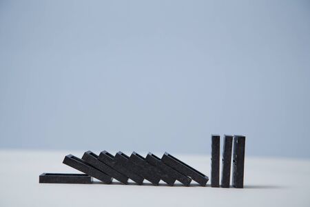Falling domino blocks, copy space. Financial crisis. Stop total collapse. Domino effect mockup...