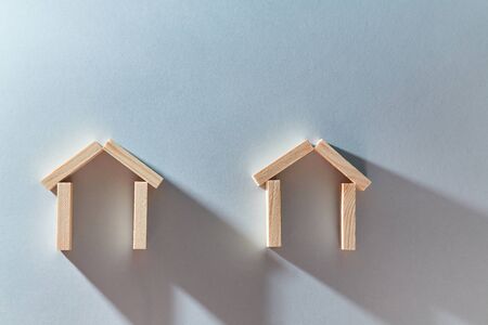 Houses of wooden bricks mockup for creative design, place for text. Immovable property. Buying and selling real estate.の写真素材