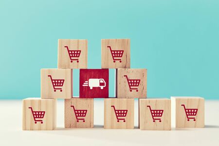 Online shopping, delivery service. E-commerce, e-store. On-line supermarket. Wooden cubes with trolley, truck signの写真素材