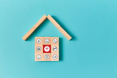 Online delivery. Online order. Food delivery. Wide range of meals. Wooden cubes with symbols under roof. Copy spaceの写真素材