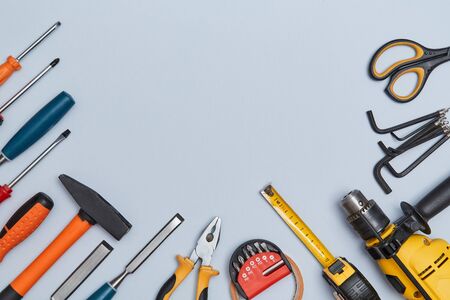 Tacks scissors tape measure screwdriver tools. Construction site and equipment. Copy space. Isolated...