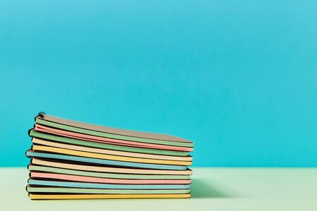 Stationery. Time to school. Welcome back to school. Start of schooling. Stack of new copy-books with...