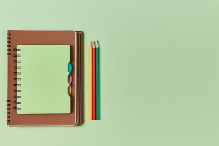 Start of new academic year. Beginning of schoolyear. Stationery. Stack of notepads and colorful...
