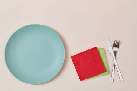 Festive event. Party time. Holiday celebration. Table setting. Top view of plates, napkins, fork and knife, copy spaceの写真素材