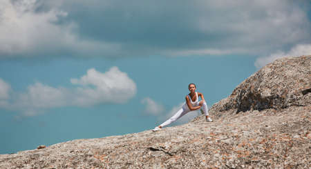 Woman stretching before running. Healthy active lifestyle. Sport training outdoors. Morning workout....
