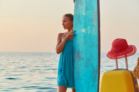 Board for sea surf. Idea of summer time, desire of adventure, copy space. Girl on summer trip,...
