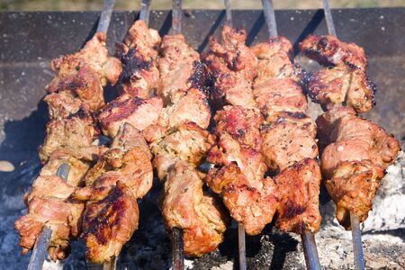 Shish kebab preparation on a brazierの写真素材