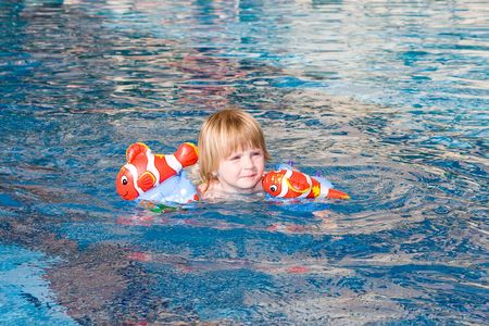 Little girl in the swimming poolの写真素材