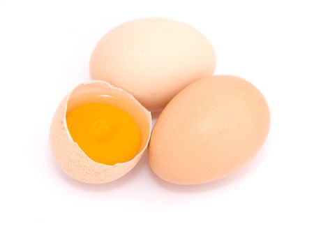 Fresh eggs on white backgroundの写真素材