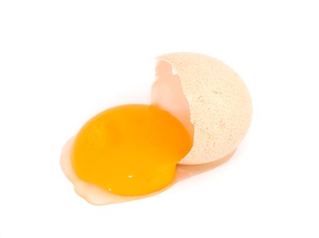 Broken egg on white backgroundの写真素材
