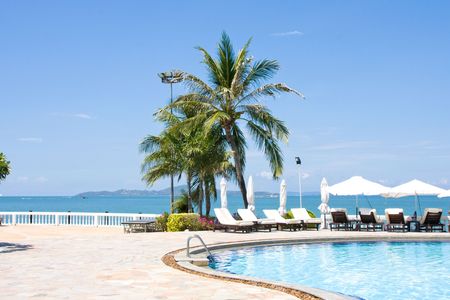 Swimming pool on a sunny day.Pattaya city in Thailand .