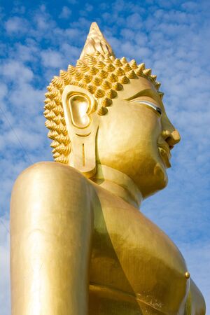Buddha image in a temple at Thailandの写真素材