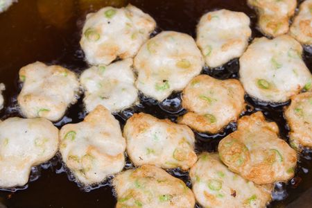 Pancakes in an iron skillet over an open fireの写真素材