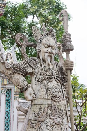 Traditional statue at the temple Wat phra kaeo in the Grand palace area in Bangkok, Thailandの写真素材
