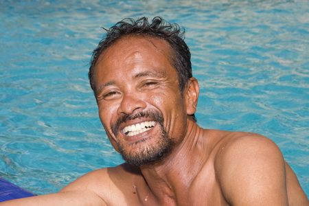 Thai man in the poolの写真素材