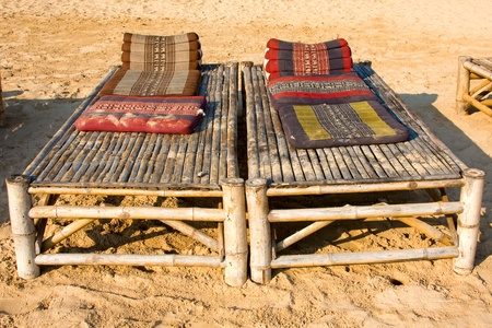 Wooden sunbeds on the background . Thailand .の写真素材
