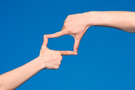 Human united hands on the sky backgroundの写真素材