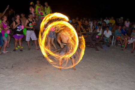 PHANGAN - DECEMBER 10 : There are about 10,000 people every month at this Phangan beach Full moon party, on December 10, 2011 in Koh Phangan , Thailand .のeditorial素材