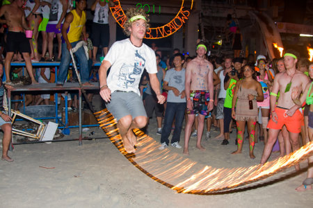 PHANGAN - DECEMBER 10 : There are about 10,000 people every month at this Phangan beach Full moon party, on December 10, 2011 in Koh Phangan , Thailand .のeditorial素材