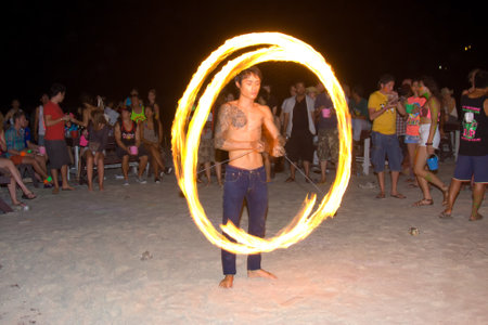 PHANGAN - DECEMBER 10 : There are about 10,000 people every month at this Phangan beach Full moon party, on December 10, 2011 in Koh Phangan , Thailand .のeditorial素材
