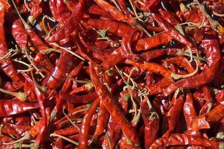 Background of closeup red hot peppers .の写真素材