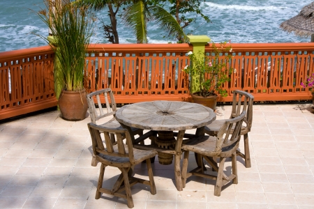 Table and chairs with a beautiful sea view . Thailand .の写真素材