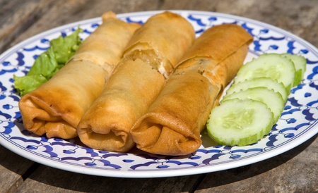 Chinese spring rolls with vegetable on the plateの写真素材