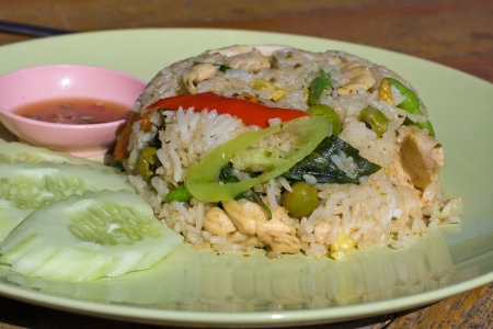 Rice with chicken and vegetables on the plateの写真素材