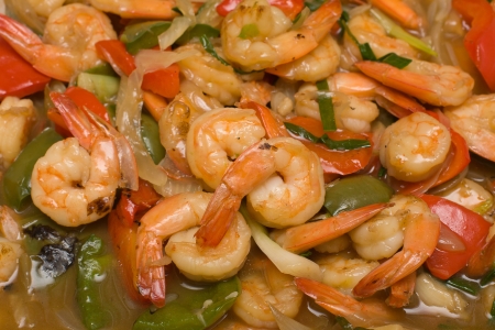 Closeup of plate of Shrimp with asparagus, bell pepper, origan and sauceの写真素材