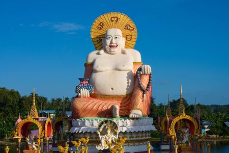 Smiling Buddha of wealth statue on Koh Samui, Thailandの写真素材