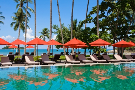 Swimming pool by the sea in Thailandの写真素材