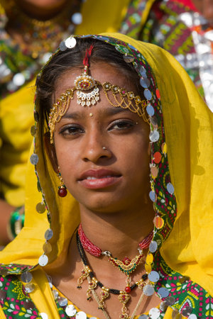 PUSHKAR, INDIA - NOVEMBER 21: An unidentified girl attends the Pushkar fair on November 21, 2012 in Pushkar, Rajasthan, India. Pilgrims and camel traders flock to the holy town for the annual fair.のeditorial素材