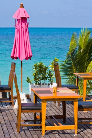 Table and chairs with a beautiful sea view on island Koh Phangan, Thailand.の写真素材