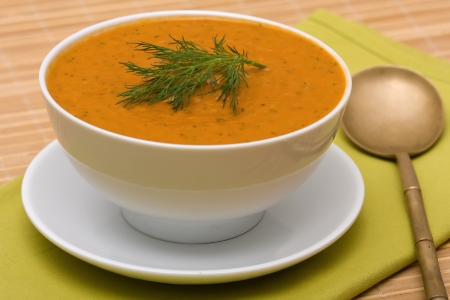 Homemade vegetable cream soup in white bowlの写真素材