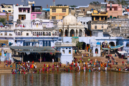 PUSHKAR, INDIA - NOVEMBER 18: people at ritual washing in the holy lake on November 18,2012 in Pushkar, India. A ritual bath in the lake is considered to lead one to salvation.のeditorial素材