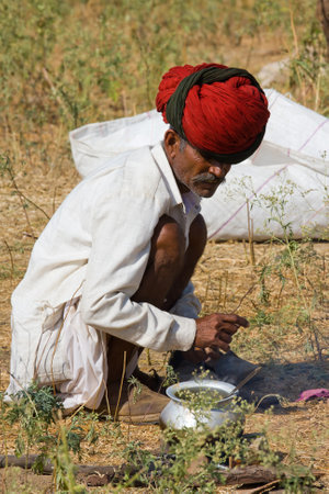 PUSHKAR, INDIA - NOVEMBER 18: An unidentified man attends the Pushkar Camel Mela on November 18,...