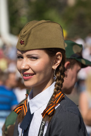 UKRAINE, KIEV - MAY 9: Ceremonial parade at Kiev main street - Khreschatyk - dedicated to the 68th Anniversary of victory in Great Patriotic War (World War II). Parade of victory on May 9, 2013 in Kiev, Ukraine. Unidentified ukrainian girl takes part in tのeditorial素材